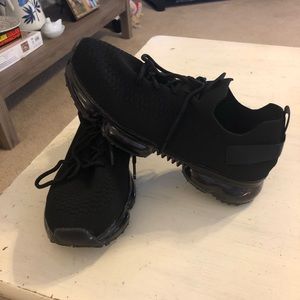 Women’s Black slip on athletic shoes.